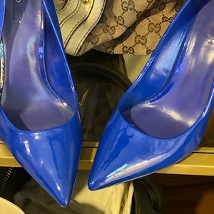 Blue Shiny pumps they’re look good with your bags